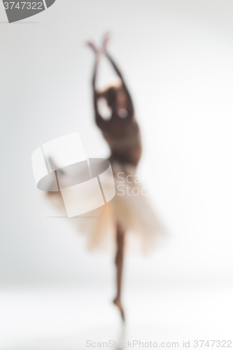 Image of Blurred silhouette of ballerina on white background