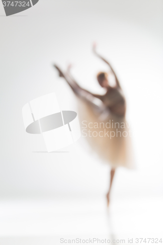 Image of Blurred silhouette of ballerina on white background