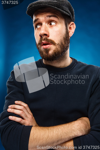 Image of The young man\'s face with eyes looking sideway