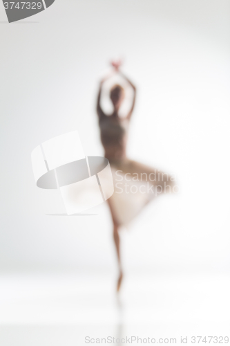 Image of Blurred silhouette of ballerina on white background