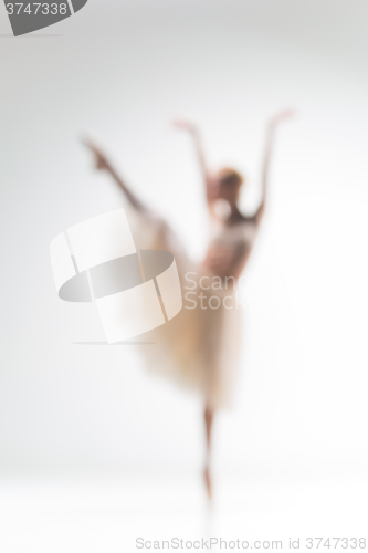 Image of Blurred silhouette of ballerina on white background