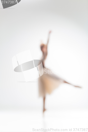 Image of Blurred silhouette of ballerina on white background