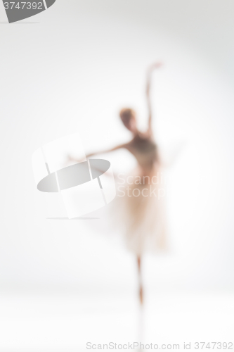 Image of Blurred silhouette of ballerina on white background