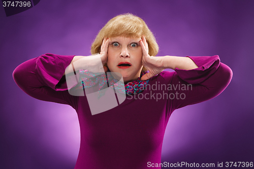Image of The surprised senior woman