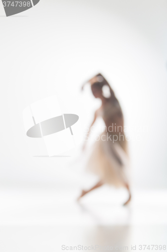 Image of Blurred silhouette of ballerina on white background