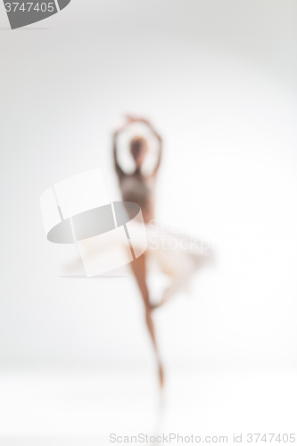 Image of Blurred silhouette of ballerina on white background