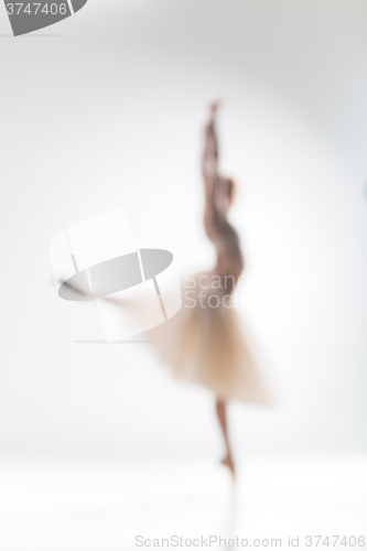 Image of Blurred silhouette of ballerina on white background