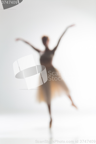 Image of Blurred silhouette of ballerina on white background