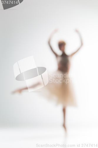 Image of Blurred silhouette of ballerina on white background