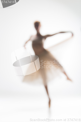 Image of Blurred silhouette of ballerina on white background