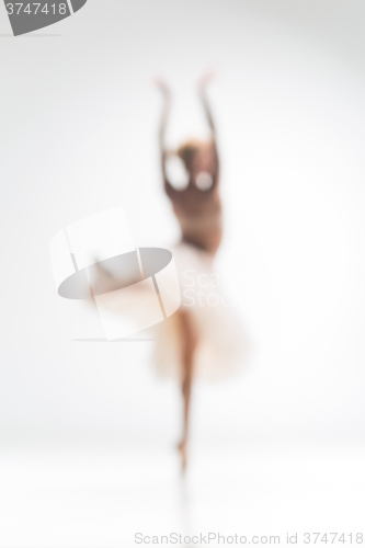 Image of Blurred silhouette of ballerina on white background