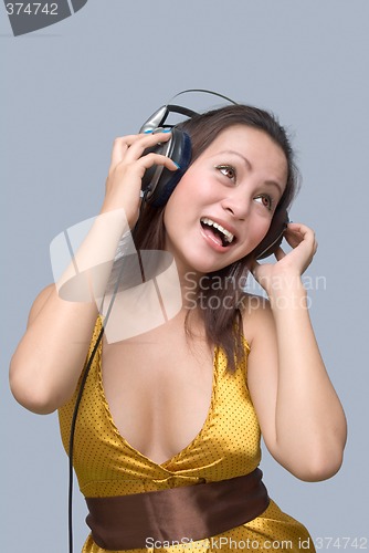 Image of Cheering girl with headphones