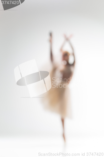 Image of Blurred silhouette of ballerina on white background