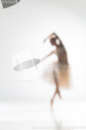 Image of Blurred silhouette of ballerina on white background