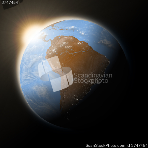 Image of Sun over South America on planet Earth