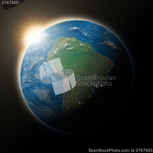 Image of Sun over South America on planet Earth