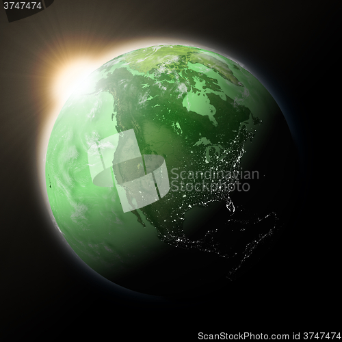 Image of Sun over North America on green planet Earth