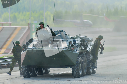 Image of BTR-82A armoured personnel carrier with soldiers