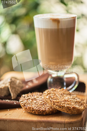 Image of coffee latte cup with cookies