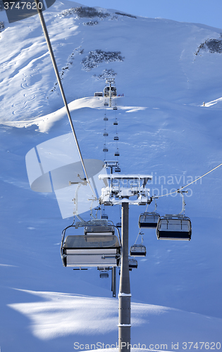 Image of Chair-lift at early morning after snowfall
