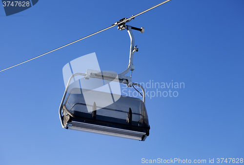 Image of Chair-lift and blue sky