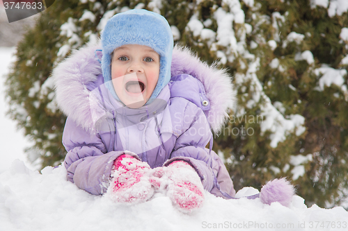 Image of  Girl lying in a snowdrift snow