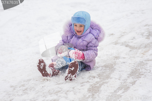 Image of Girl with snow-covered rolling hills