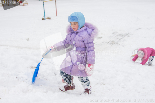 Image of  Girl wearily climbs icy hill