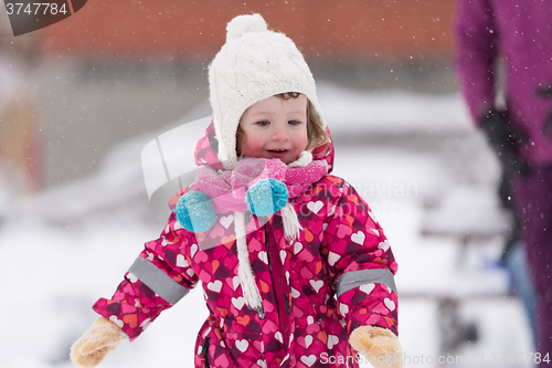 Image of little girl at snowy winter day