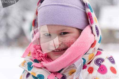 Image of little girl at snowy winter day