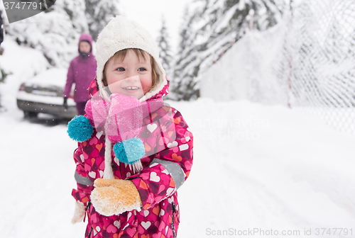 Image of little girl at snowy winter day