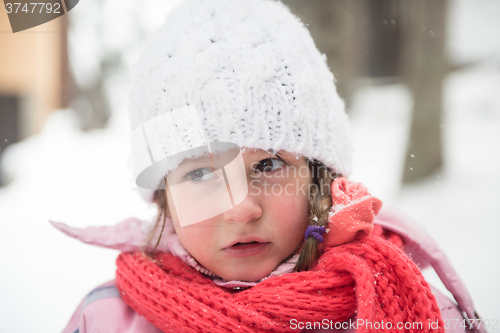 Image of little girl at snowy winter day