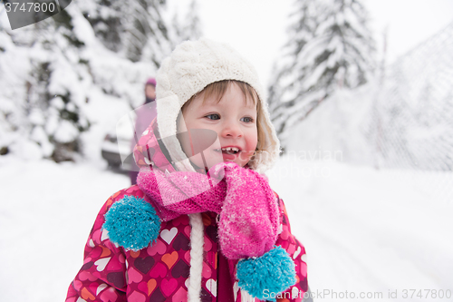 Image of little girl at snowy winter day