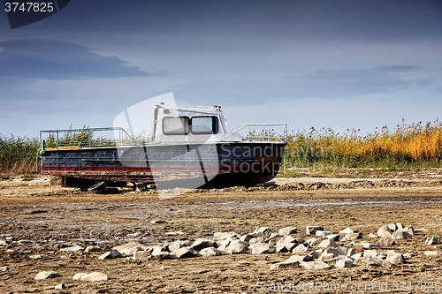 Image of Dried lake with some boats