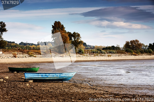 Image of Dried lake with some boats