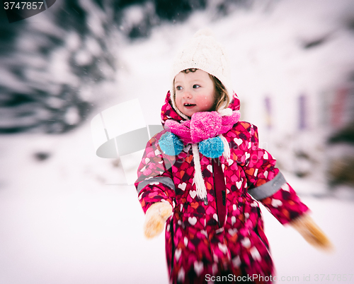 Image of little girl at snowy winter day
