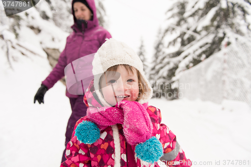 Image of little girl at snowy winter day