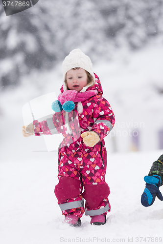 Image of little girl at snowy winter day