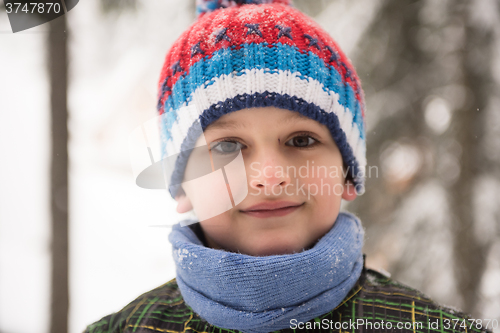 Image of little boy having fun on winter day