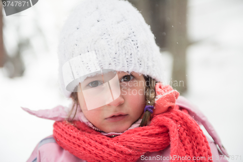 Image of little girl at snowy winter day