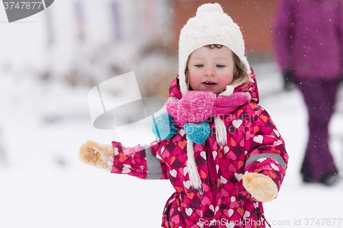 Image of little girl at snowy winter day
