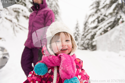 Image of little girl at snowy winter day