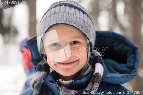 Image of little boy having fun on winter day