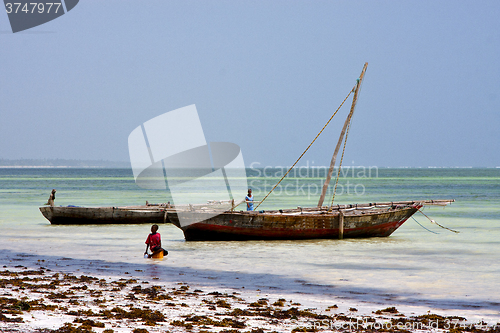 Image of boat people and   lagoon relax  of zanzibar africa