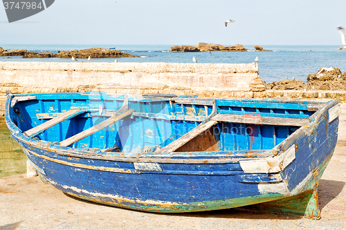 Image of   boat and  in africa   castle brown brick  sky