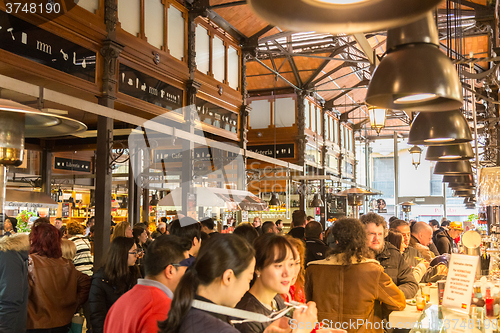 Image of People drinking and eating at San Miguel market, Madrid.