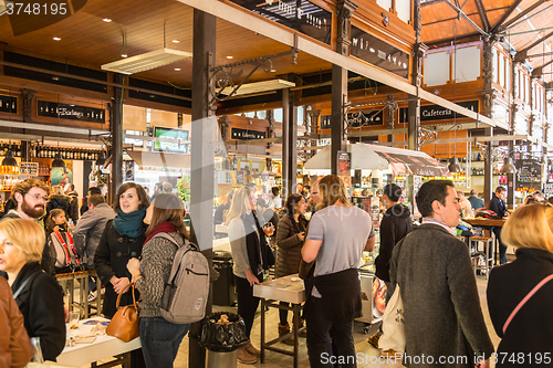 Image of People drinking and eating at San Miguel market, Madrid.