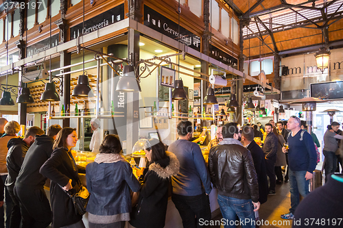 Image of People drinking and eating at San Miguel market, Madrid.