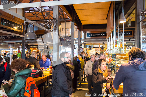 Image of People drinking and eating at San Miguel market, Madrid.