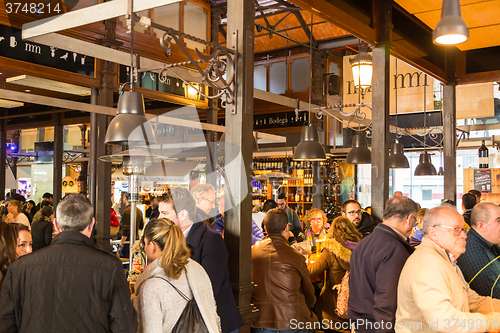 Image of People drinking and eating at San Miguel market, Madrid.